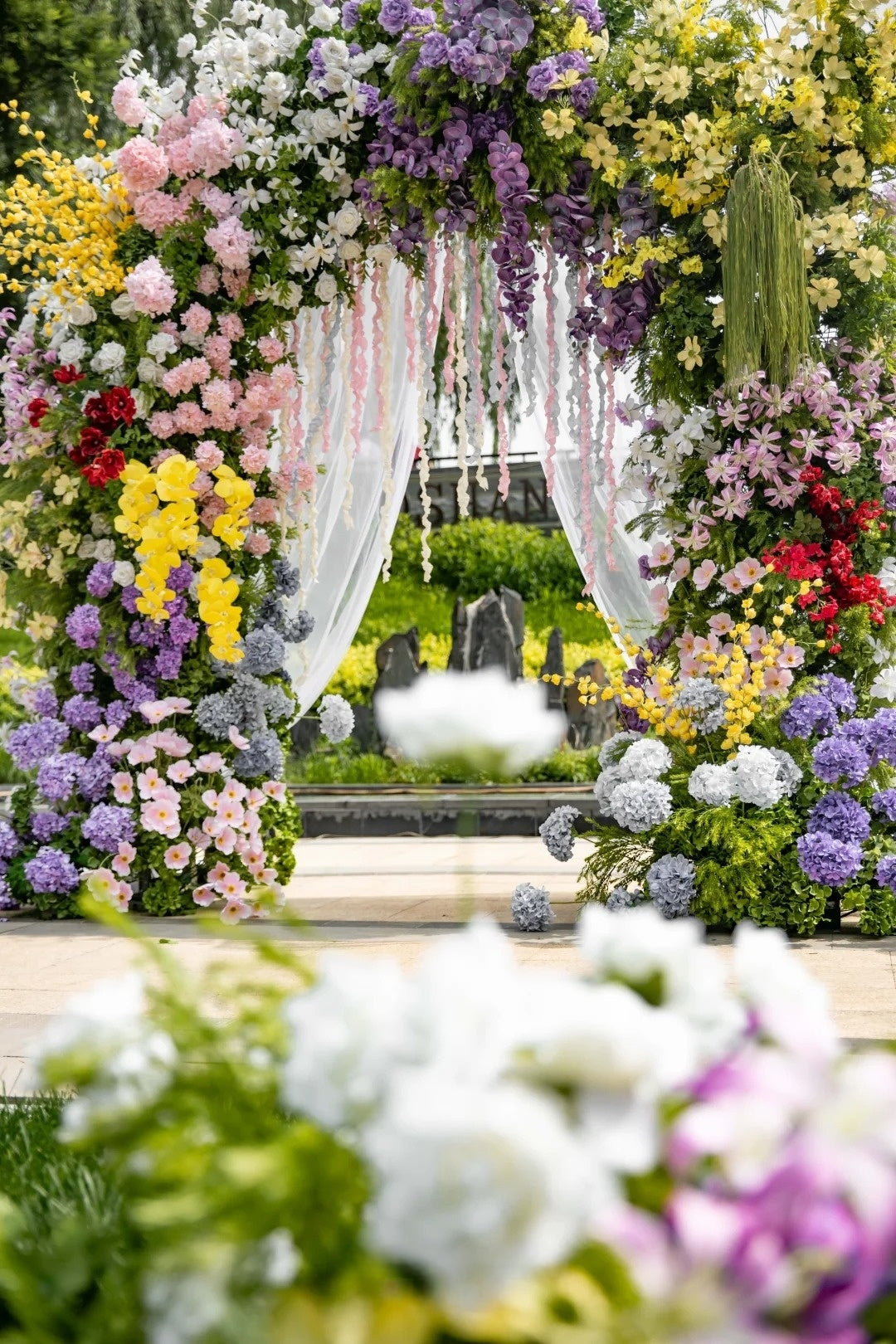 Romantic Garden Wedding Inspiration with a Colorful Floral Arch