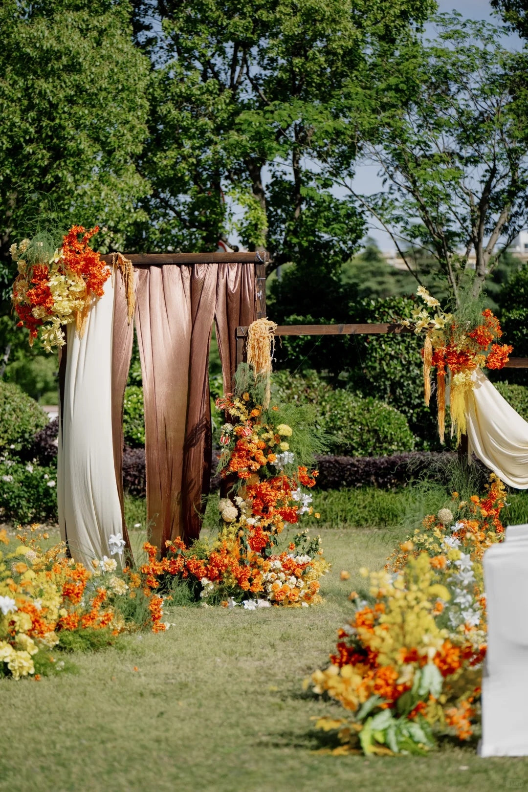 Outdoor Summer Wedding Inspiration with Warm Orange Floral Draping