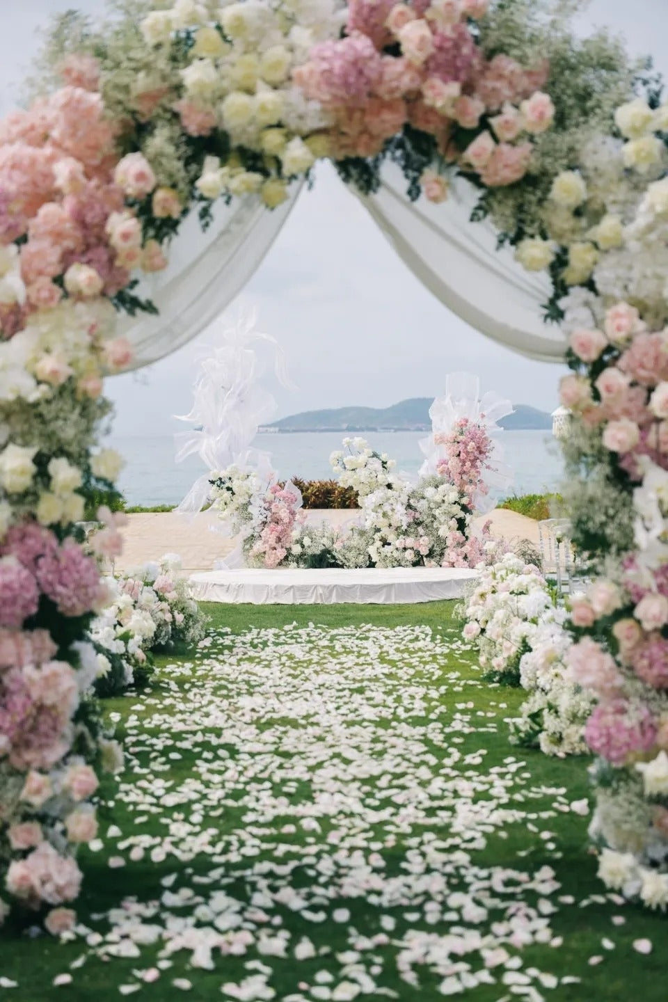 Romantic Seaside Wedding Ideas with Blush Pink and White Floral Arches