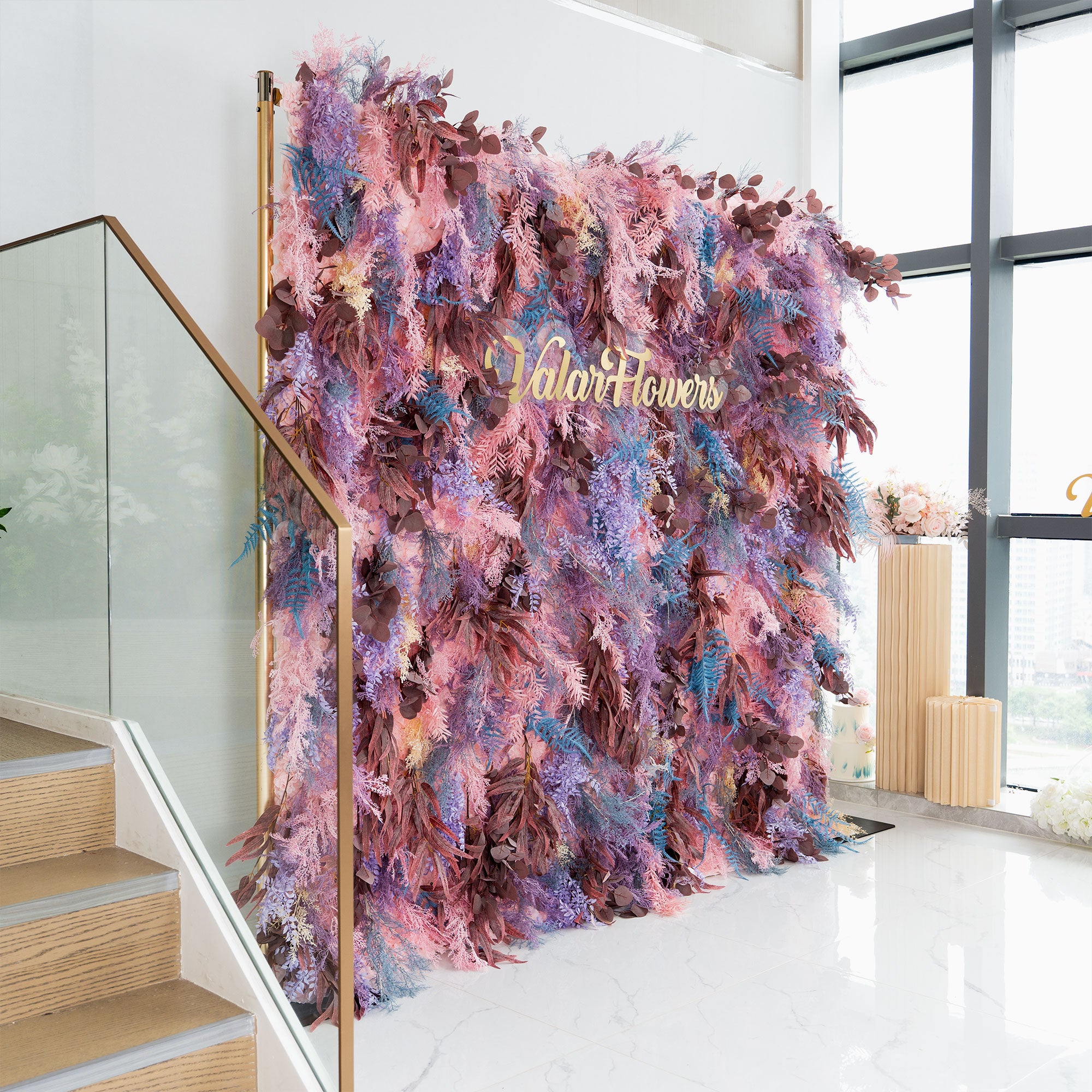 Lush lavender and pink faux foliage flower wall backdrop for ceremonies and receptions