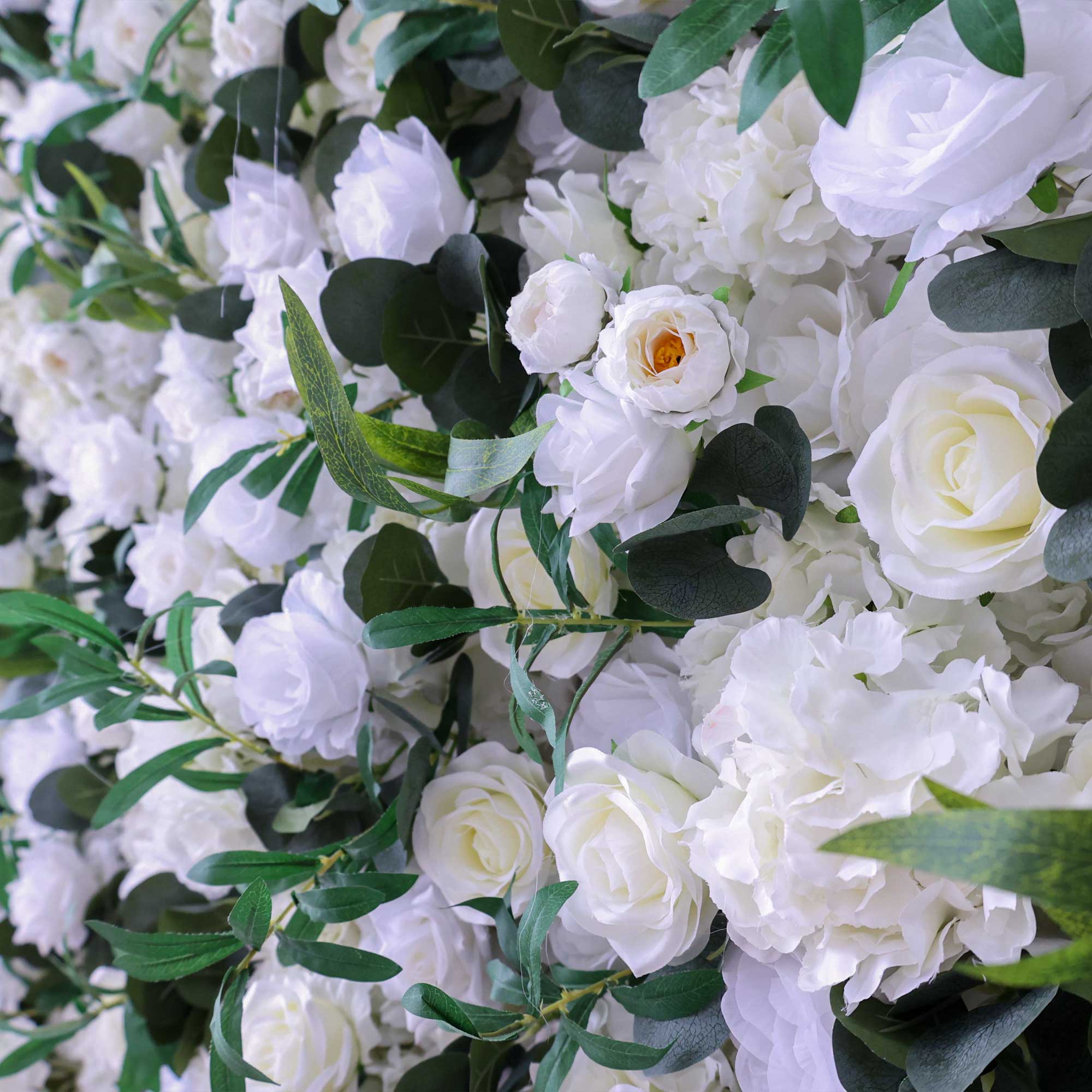 Handcrafted 5D artificial flower wall backdrop with white roses and lush green foliage, set against a light background. Ideal for weddings, elegant events, and photoshoots, adding a timeless and natural ambiance.VF-414-4
