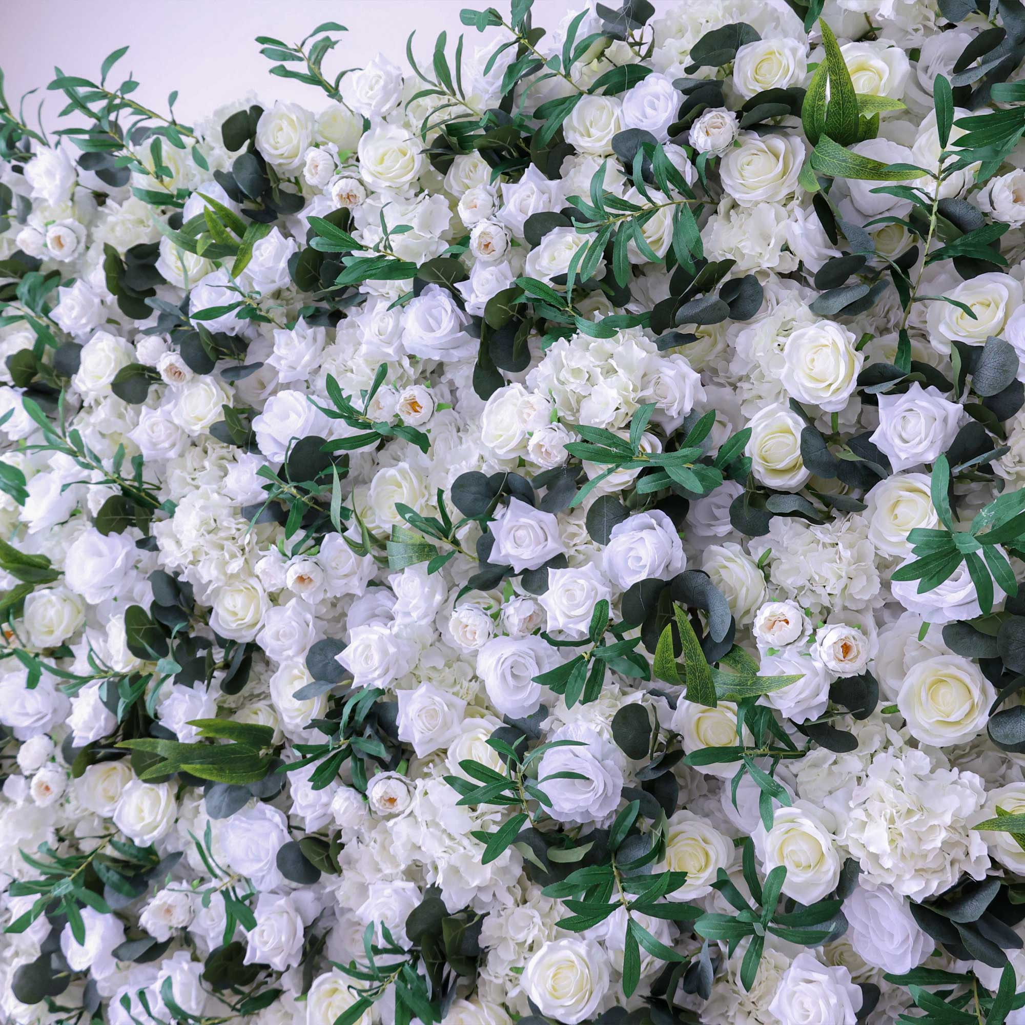 Handcrafted 5D artificial flower wall backdrop with white roses and lush green foliage, set against a light background. Ideal for weddings, elegant events, and photoshoots, adding a timeless and natural ambiance.VF-414-5