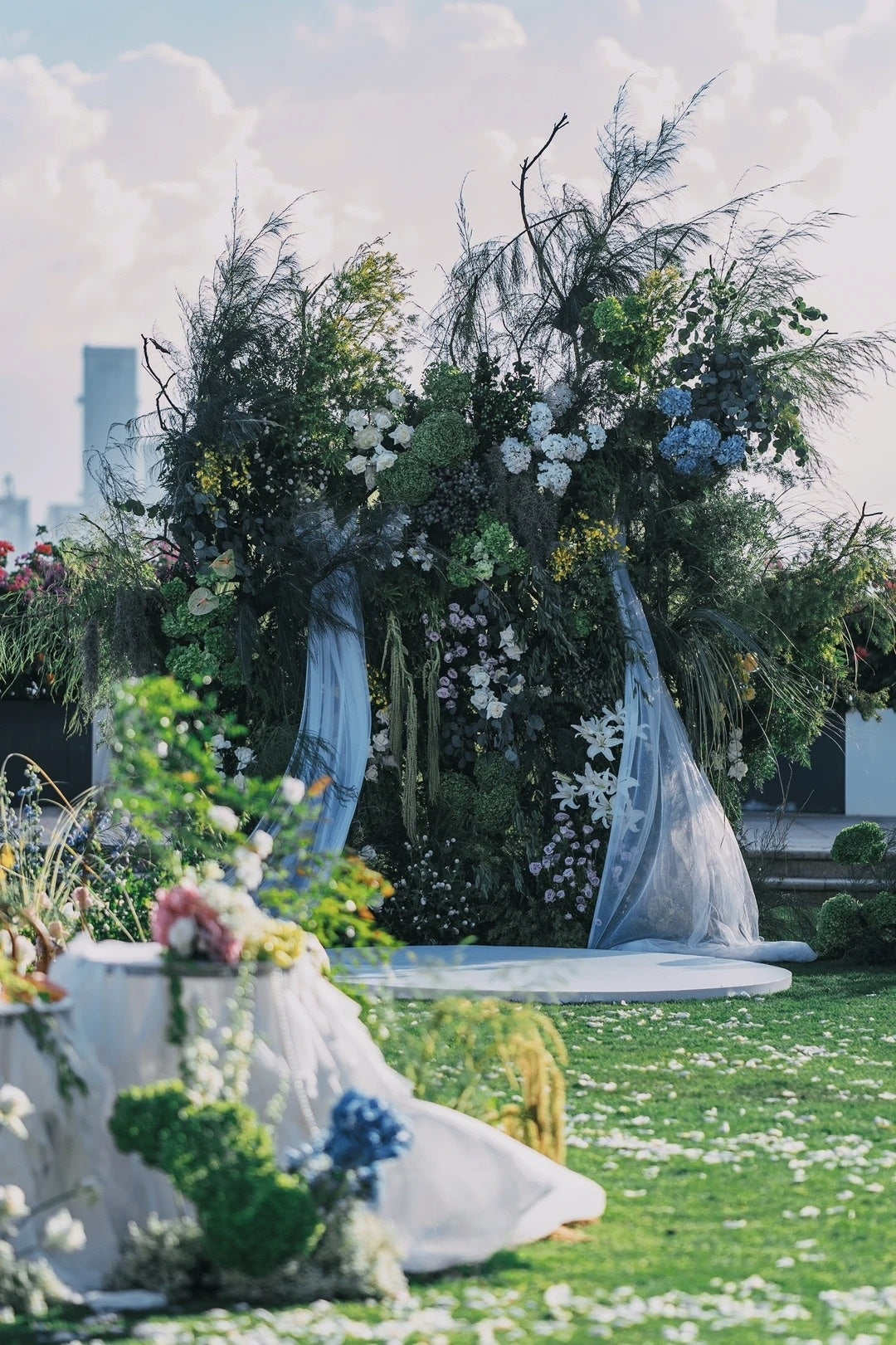 A Romantic Waterfront Garden Wedding with Blue and White Floral Styling
