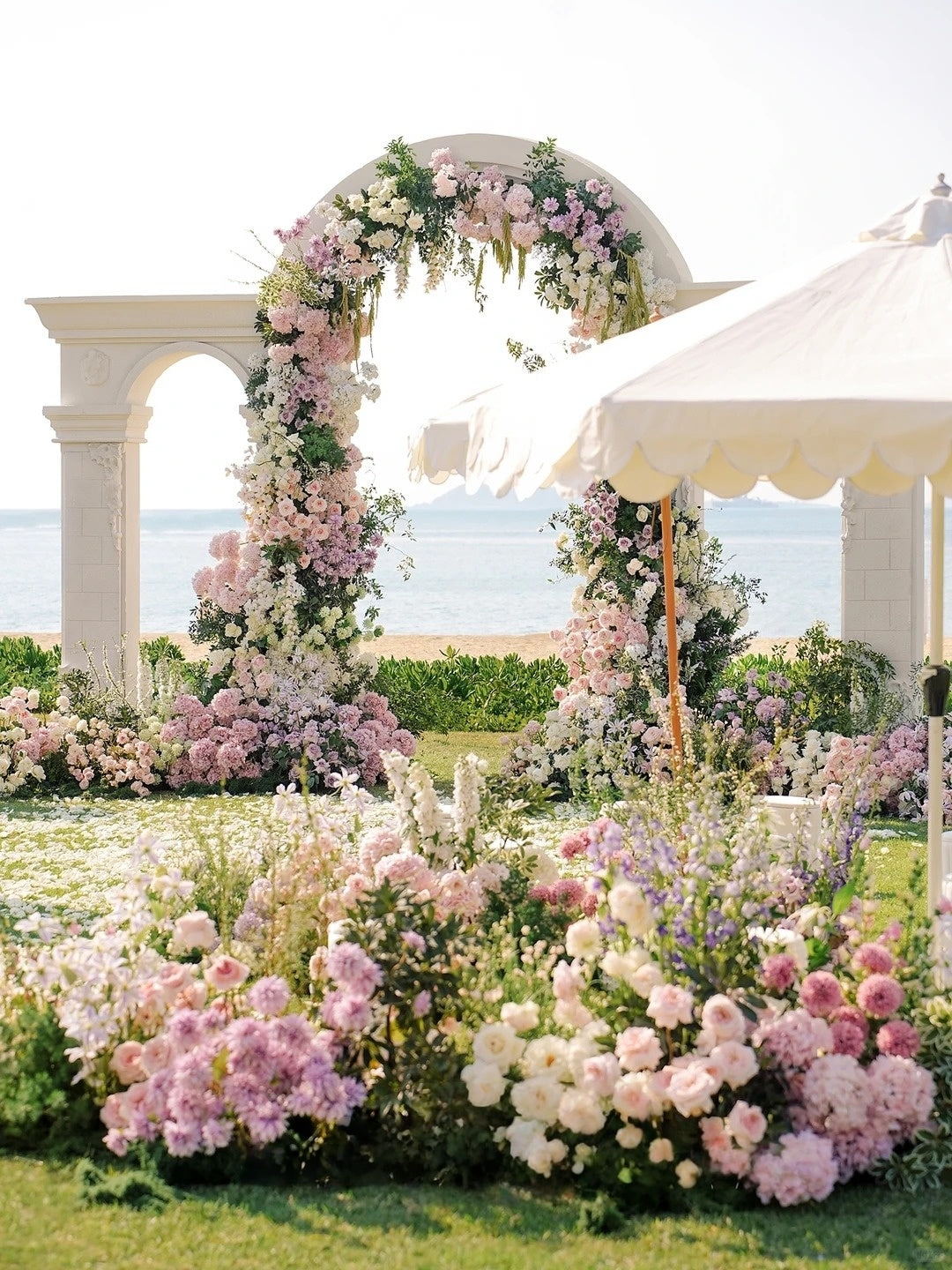 Soft Pink and White Coastal Wedding Inspiration with Romantic Floral Arch Decor