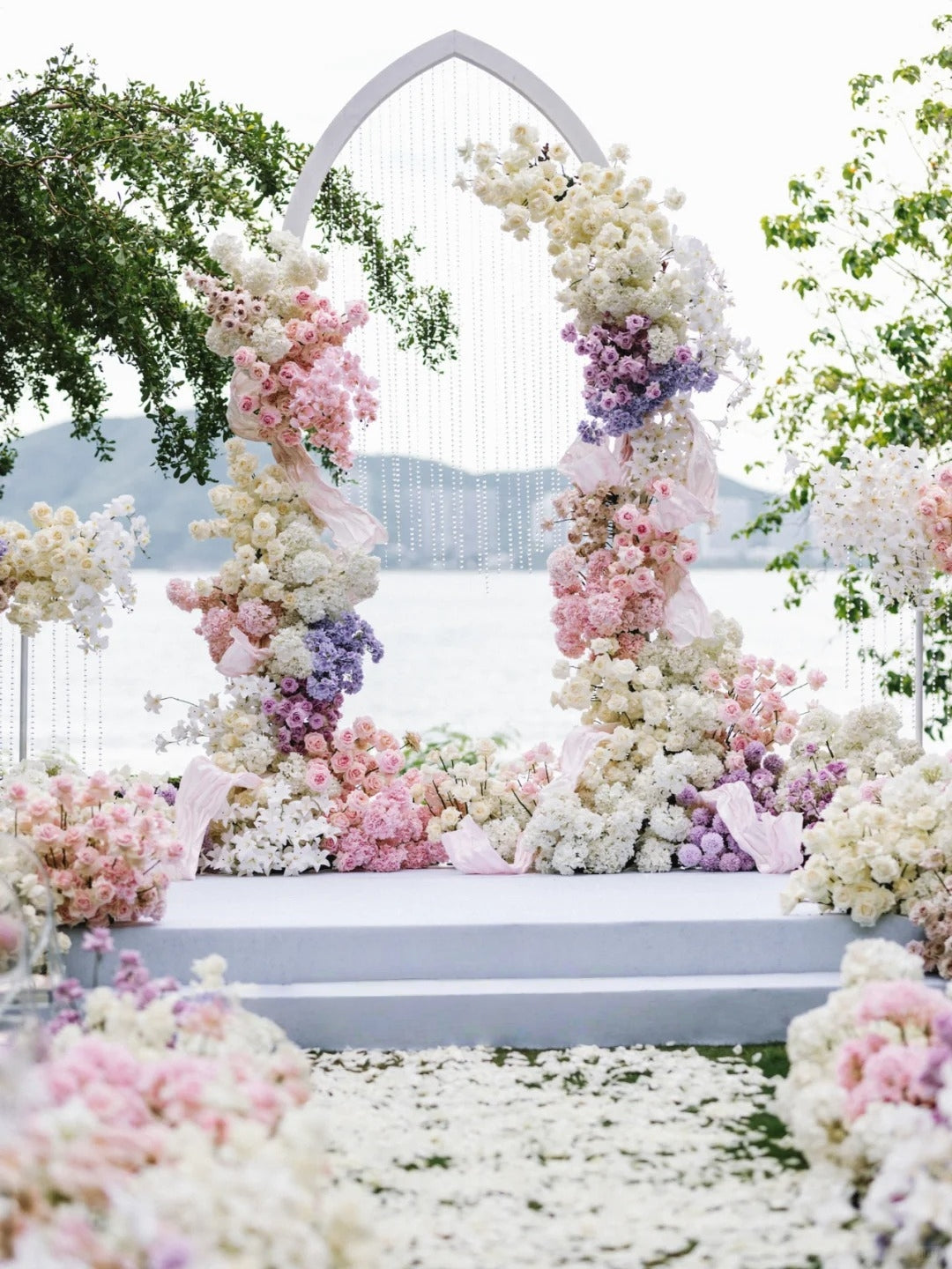 Pastel Garden Seaside Wedding with Floral Arch and Crystal Details