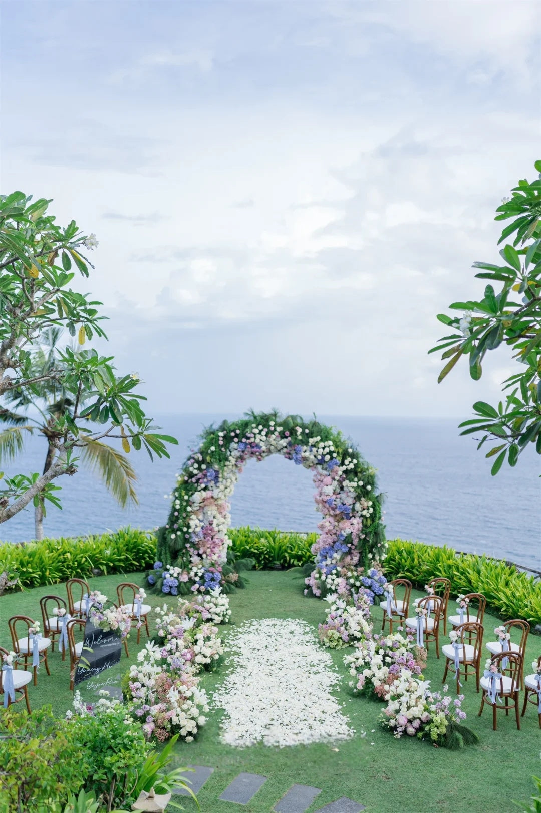 Romantic Ocean View Wedding Inspiration with a Pastel Floral Arch
