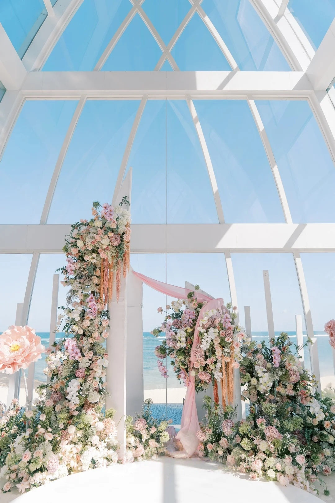 Bali Oceanfront Wedding Inspiration with Romantic Floral Installations and Soft Pastel Elegance