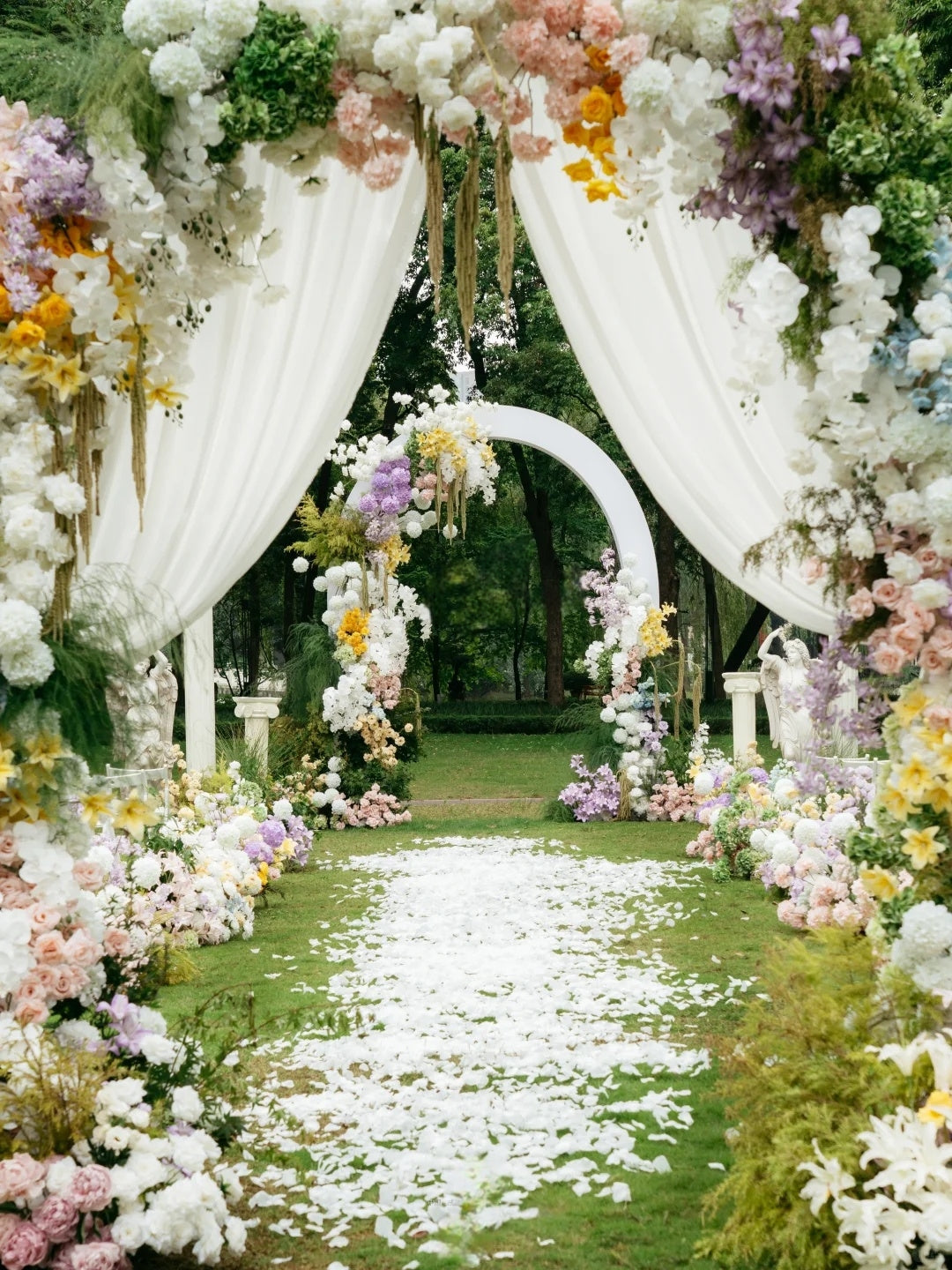 Romantic Garden Wedding Ceremony with Pastel Floral Arch Decor
