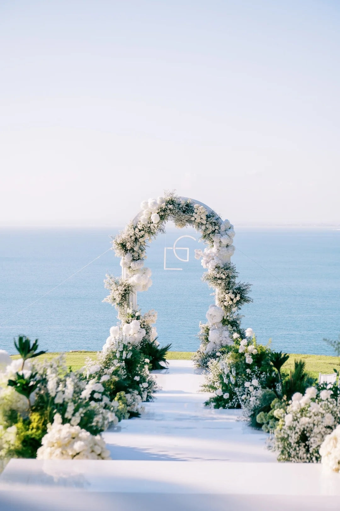 Bali Ocean Cliff Wedding Inspiration with a White Floral Arch