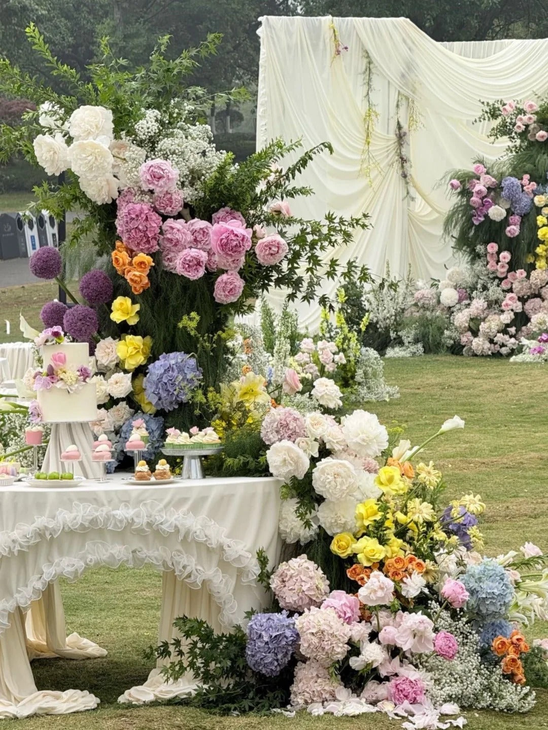 Romantic Garden Wedding with White Drapery, Oversized Bows and Colorful Florals