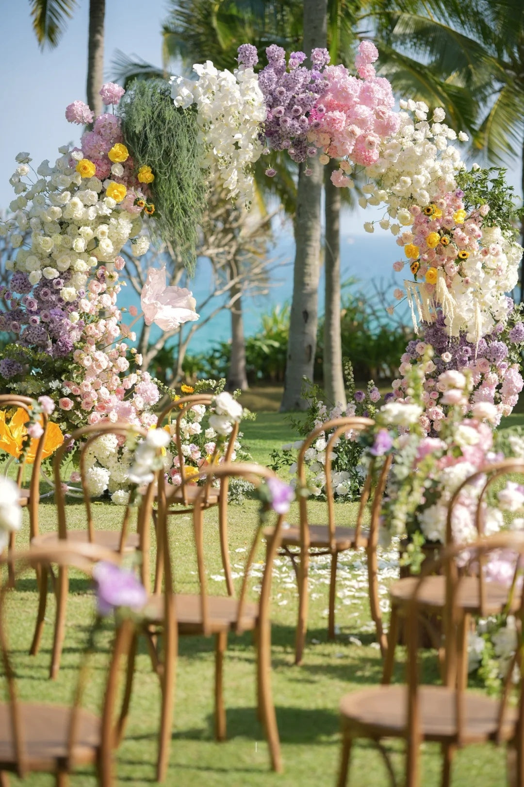 🌴 Tropical Outdoor Wedding Decor Ideas with Pastel Floral Arch