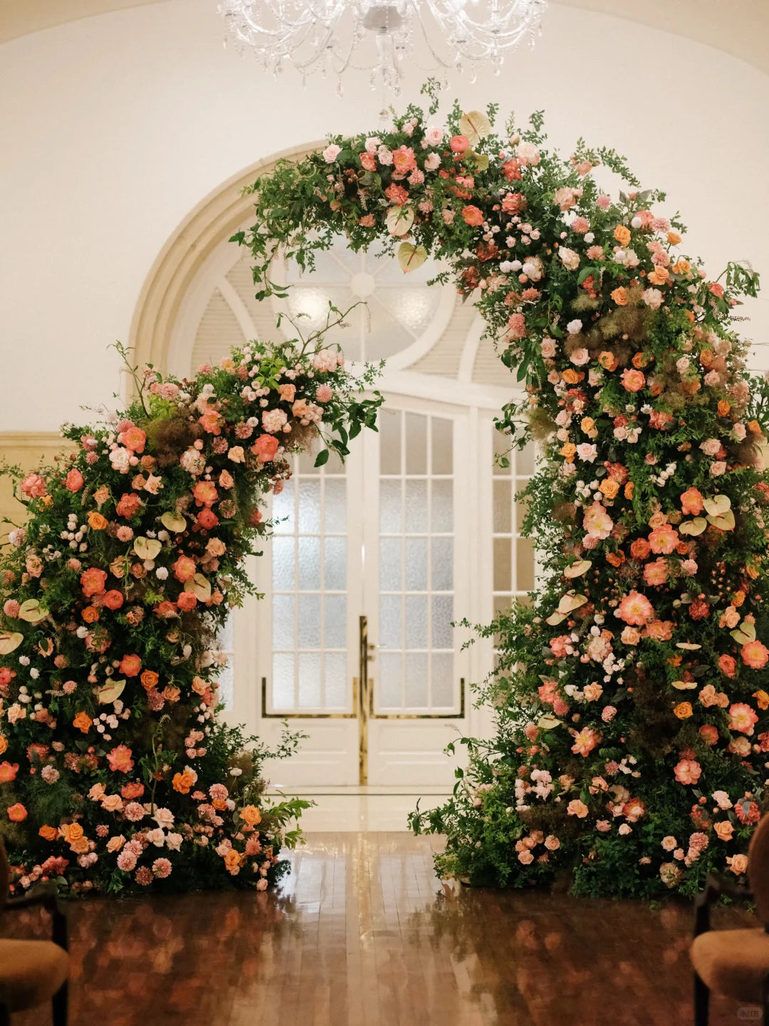 Warm Sunset Wedding Arch Inspiration — Coral & Amber Floral Ceremony Design
