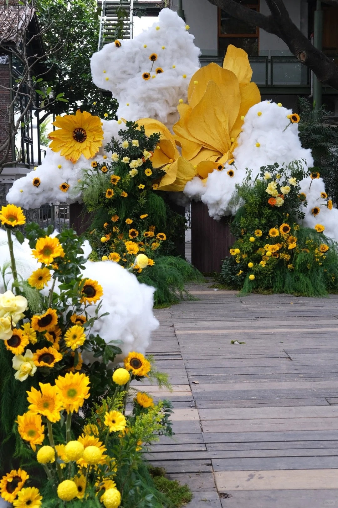 Whimsical Yellow Wedding Inspiration with Sunflowers, Cloud Decor, and Oversized Petal Installations