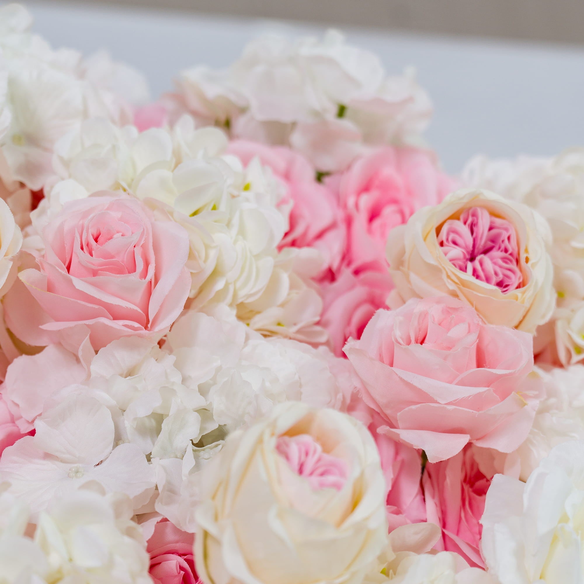 This photo showcases a lush arrangement of pink and white roses, interspersed with white hydrangeas. The soft pastel hues create a romantic and dreamy atmosphere. Ideal for weddings, bridal showers, or other love - themed events, it exudes an elegant and tender style, adding a touch of sophistication and charm to any celebration. 