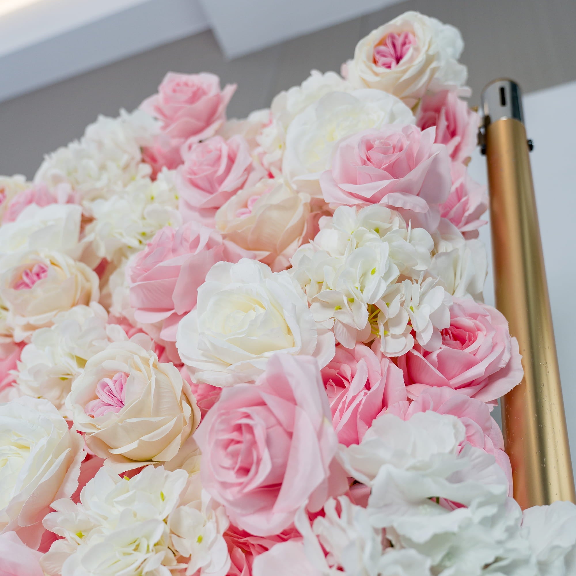 This photo captures a close - up of a lush floral arrangement. It prominently features a mix of pink and white roses, along with white hydrangeas. The soft pastel colors create a romantic and elegant atmosphere. Ideal for weddings, bridal showers, or other romantic events, this backdrop exudes a dreamy and sophisticated style, adding a touch of charm to any celebration. 
