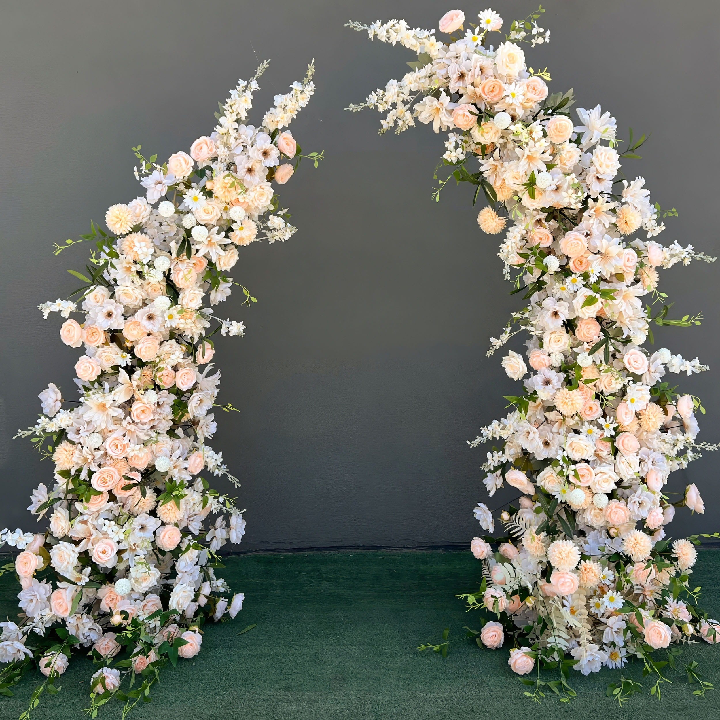 Exquisite artificial floral arch for weddings, parties, and special events. Adorned with soft peach and white flowers (roses, peonies, daisies) and delicate greenery. Features a cascading effect on a sturdy frame, suitable for indoor and outdoor use. Elegant and romantic design.