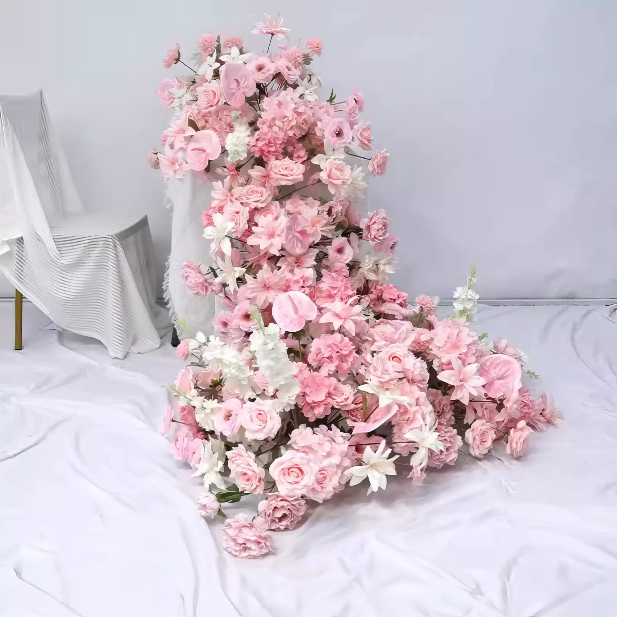 Romantic floral table runner adorned with soft pink roses, delicate peonies, and elegant white lilies. Perfect for weddings or elegant gatherings, adding a dreamy, sophisticated touch to any setting with its gentle, pastel palette.