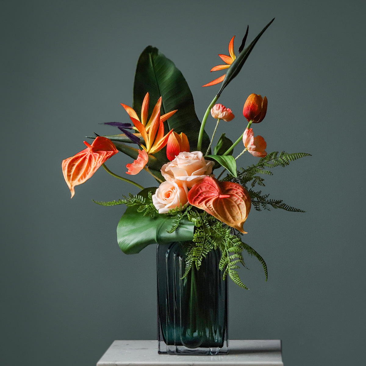 High-quality tropical silk floral arrangement with orange and green faux flowers, ideal for hotel, restaurant, and event décor.VB-104-1