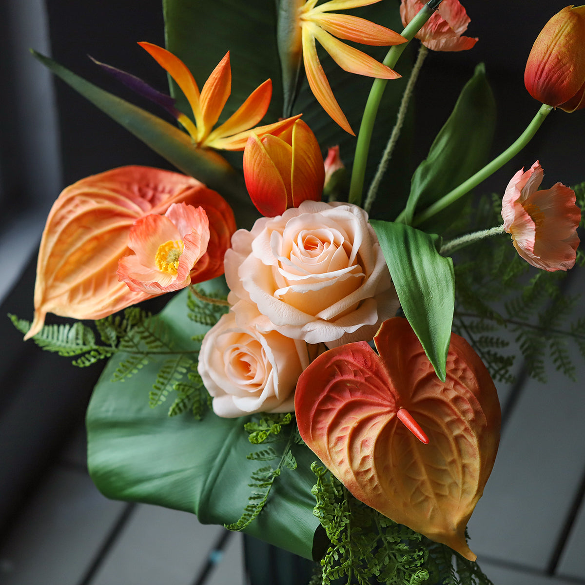 High-quality tropical silk floral arrangement with orange and green faux flowers, ideal for hotel, restaurant, and event décor.VB-104-3