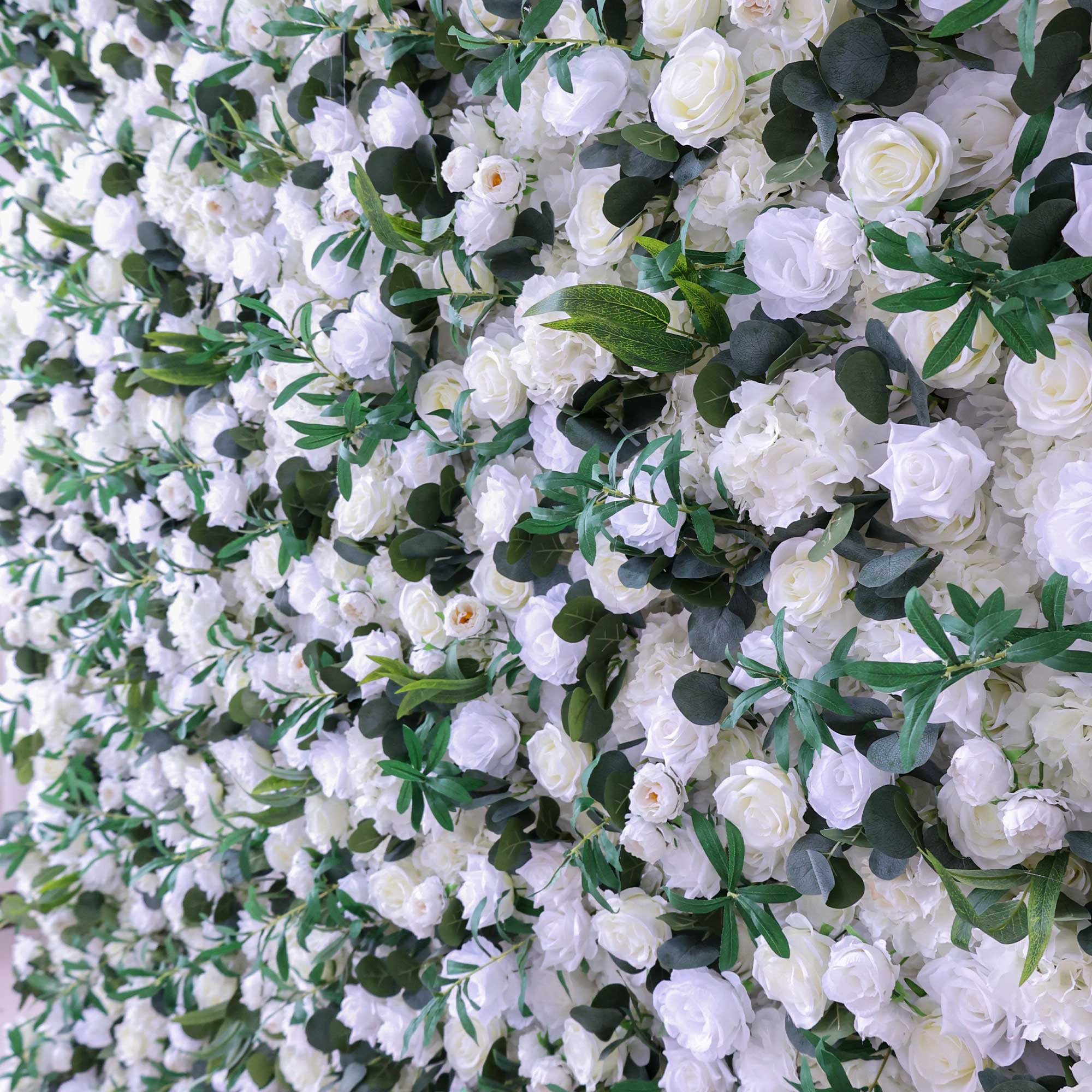 Handcrafted 5D artificial flower wall backdrop with white roses and lush green foliage, set against a light background. Ideal for weddings, elegant events, and photoshoots, adding a timeless and natural ambiance.VF-414-3