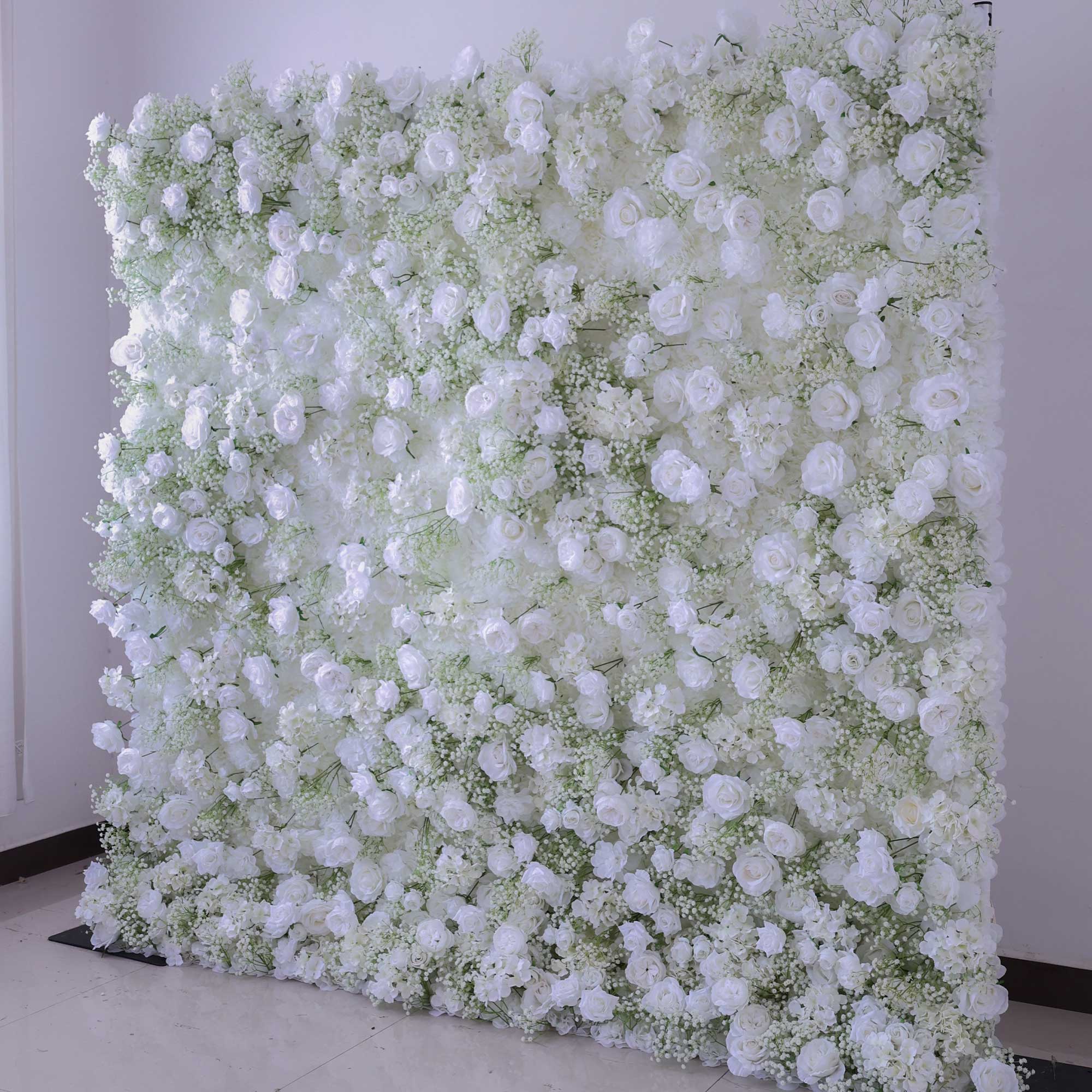 Handcrafted 5D artificial flower wall backdrop with delicate white roses and baby’s breath, set against a light background. Ideal for wedding decor, engagement party decor, and bridal showers, adding a soft, elegant ambiance for photoshoots and special events. VF-419-2