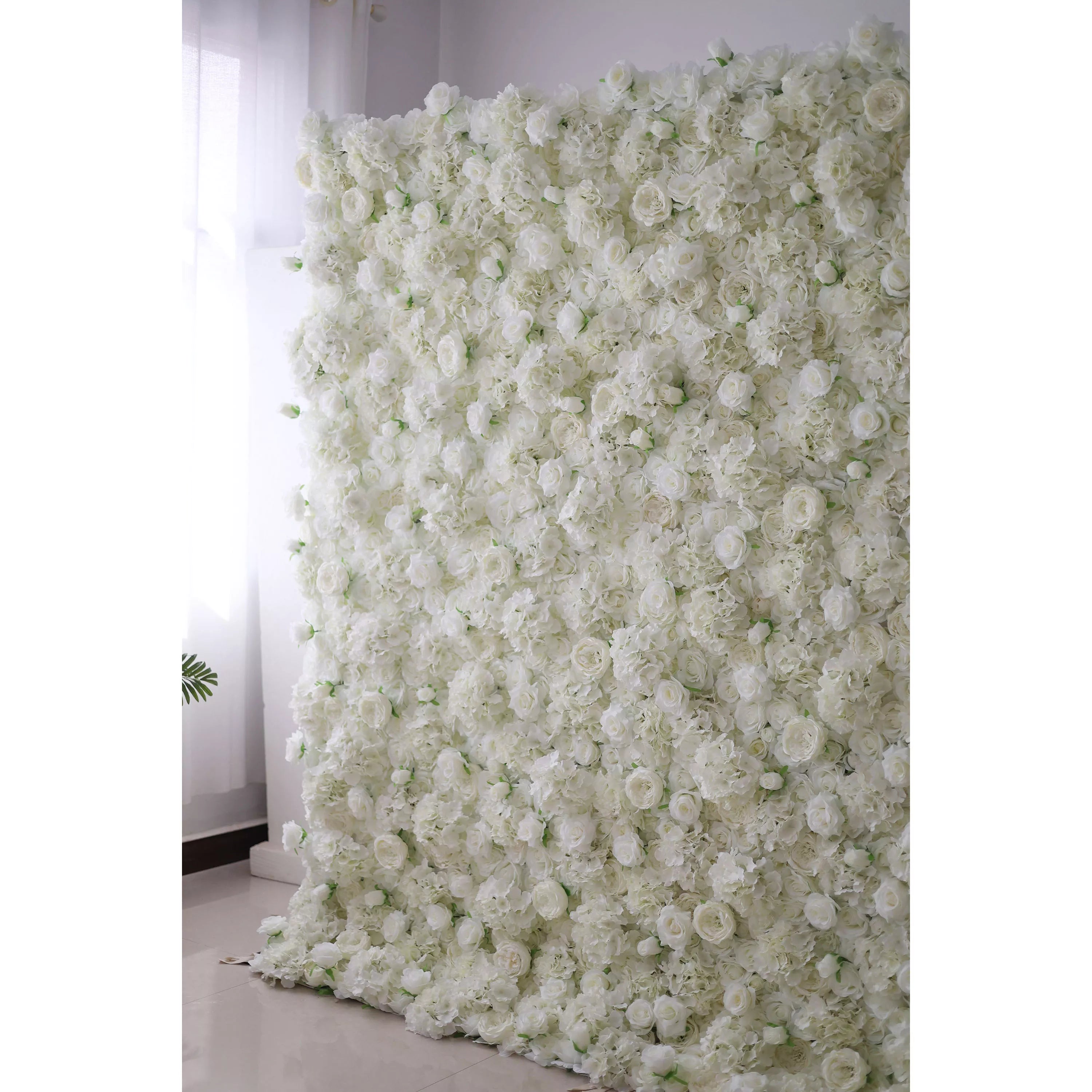 Valar Flowers' Artificial Fabric Flower Wall: Ethereal White Elegance. Immerse in an ocean of pure white blossoms; a luxurious arrangement that epitomizes classic beauty and sophistication, perfect for events desiring grace and angelic radiance.
