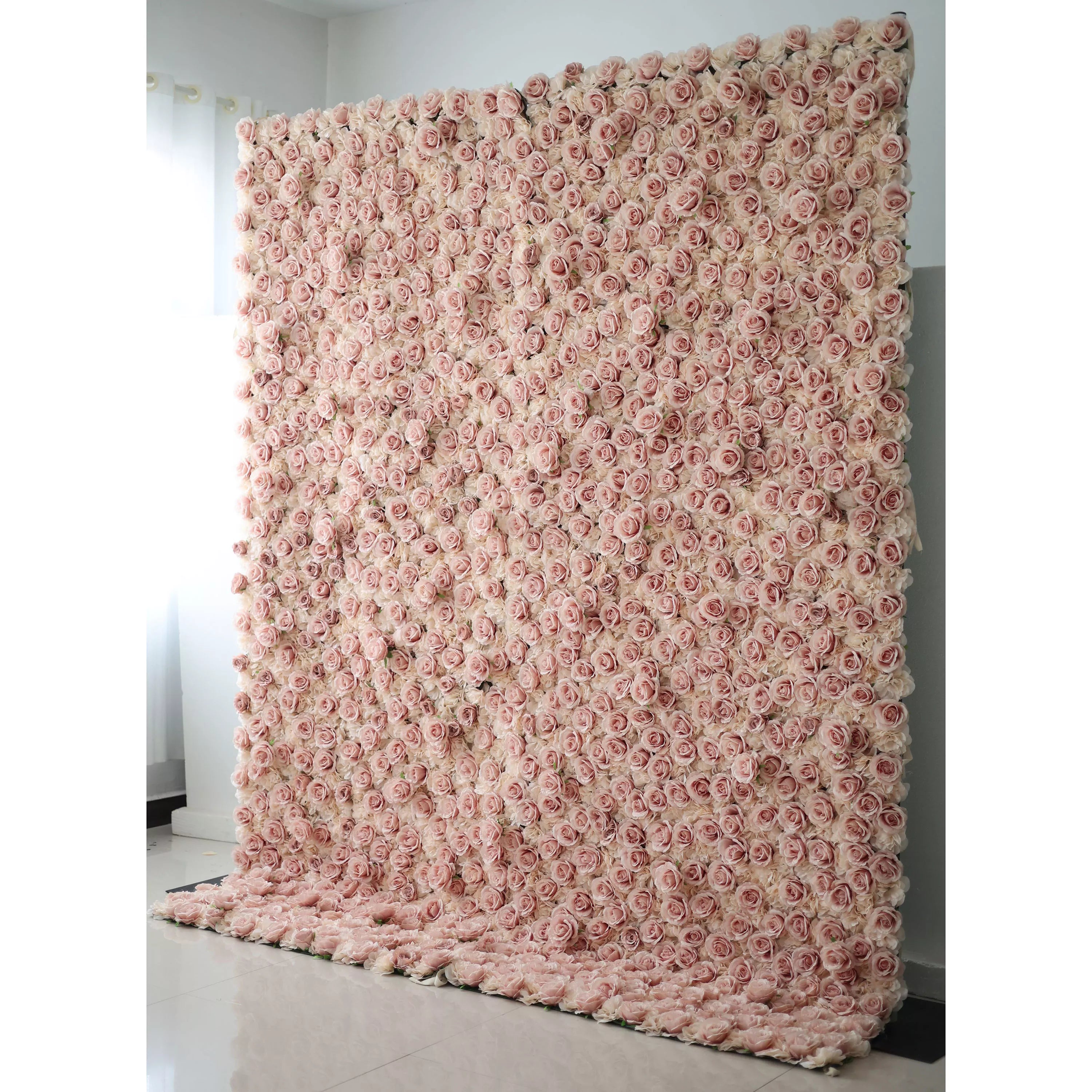 Valar Flowers' Artificial Fabric Flower Wall: Serene Rose Whispers. Dive into a sea of blushing pink blossoms. This sophisticated arrangement captures the essence of romantic ambiance, perfect for events desiring timeless beauty and floral elegance.
