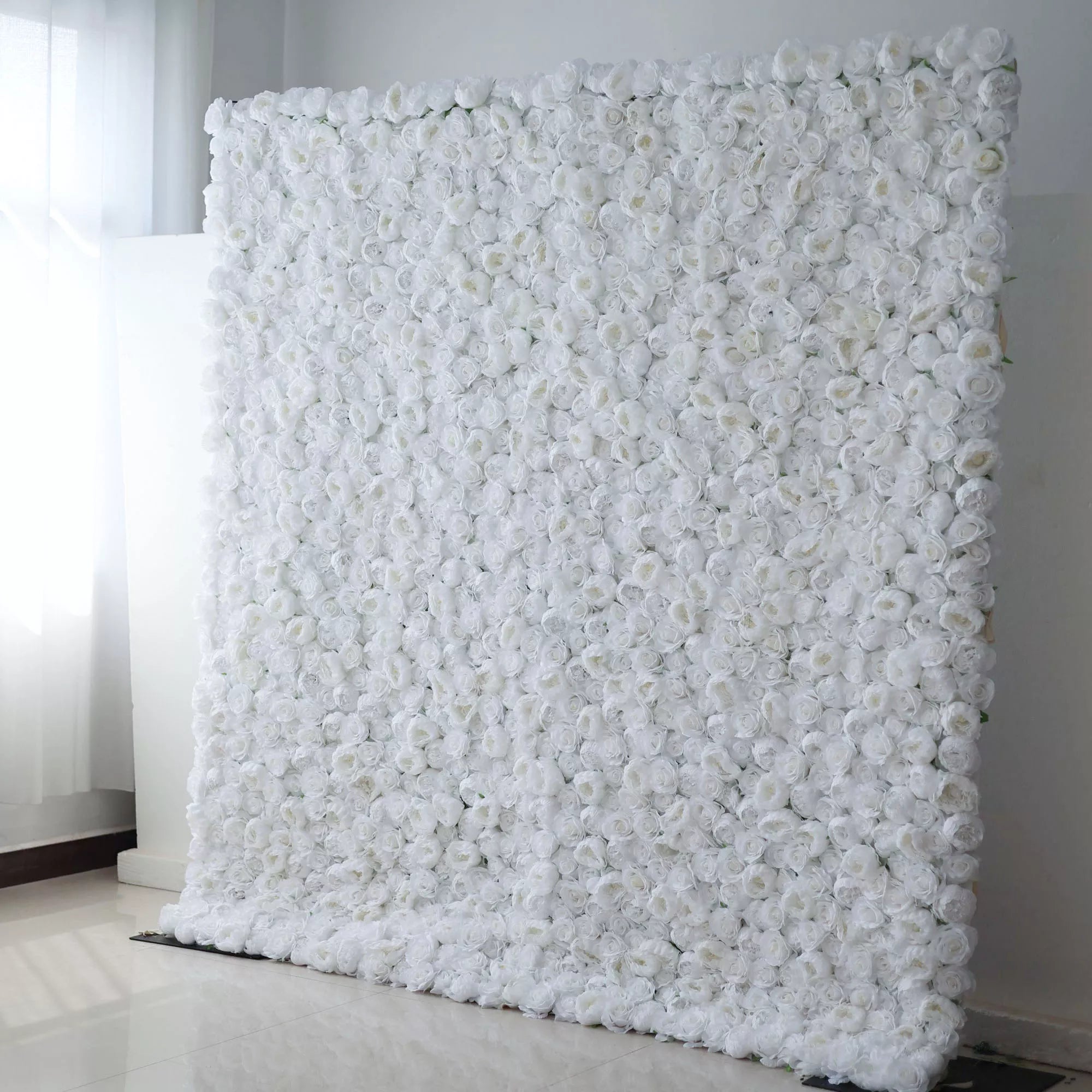 Valar Flowers' Artificial Fabric Flower Wall: White Blossom Bliss. A sea of densely packed white roses, projecting sophistication, timeless beauty, and pure romance, ideal for events cherishing elegance and captivating allure.