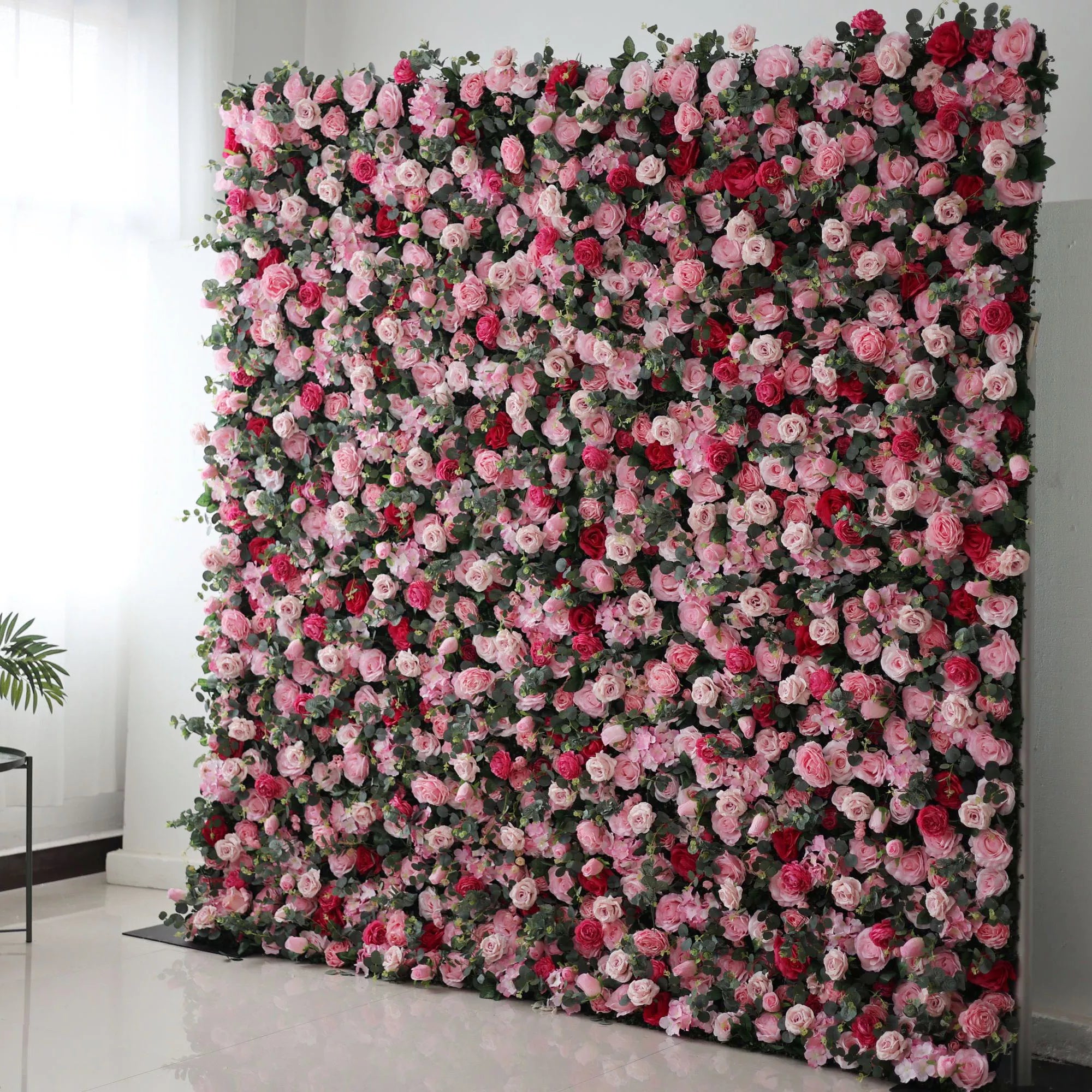 Valar Flowers' Artificial Fabric Flower Wall: Blooming Bliss. A stunning medley of pink, red, and white roses, beautifully set, creating an atmosphere of romance and botanical grandeur.