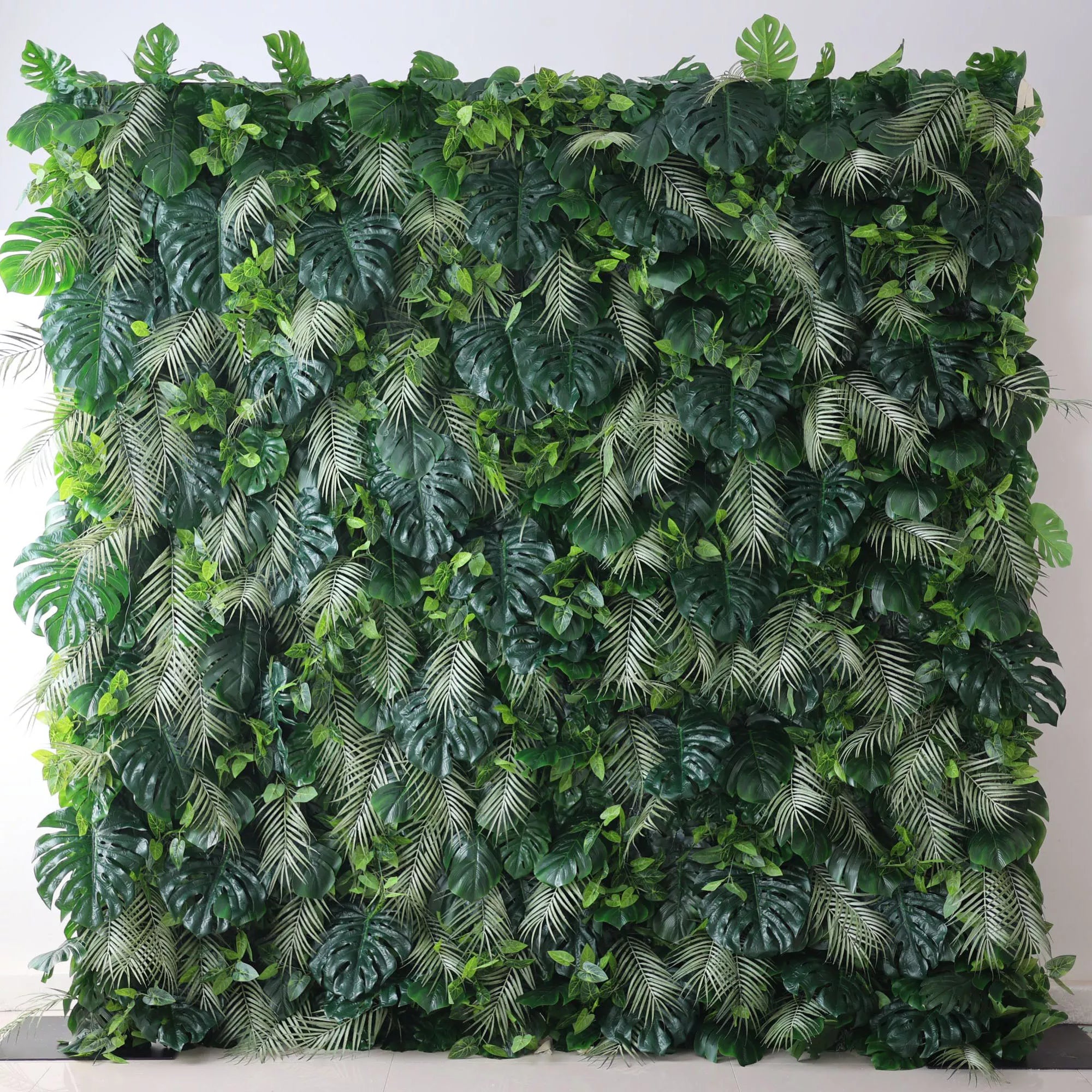 Valar Flowers' Artificial Fabric Green Wall: Tropical Eden. A luxuriant cascade of varied green leaves, meticulously crafted, capturing the heart of a tropical jungle, and radiating verdant serenity.