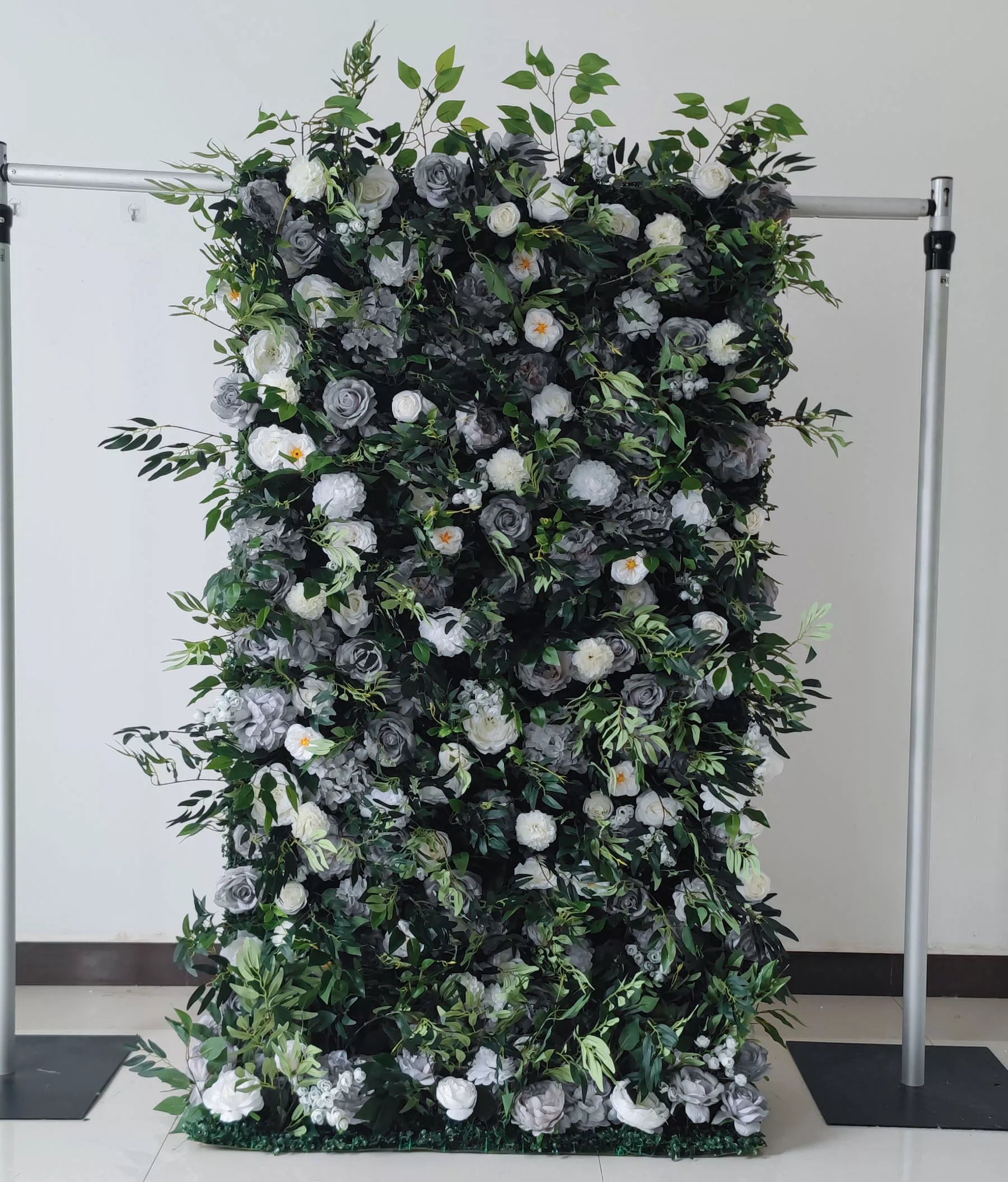 Valar Flowers grey and white roll-up artificial flower wall with green leaves